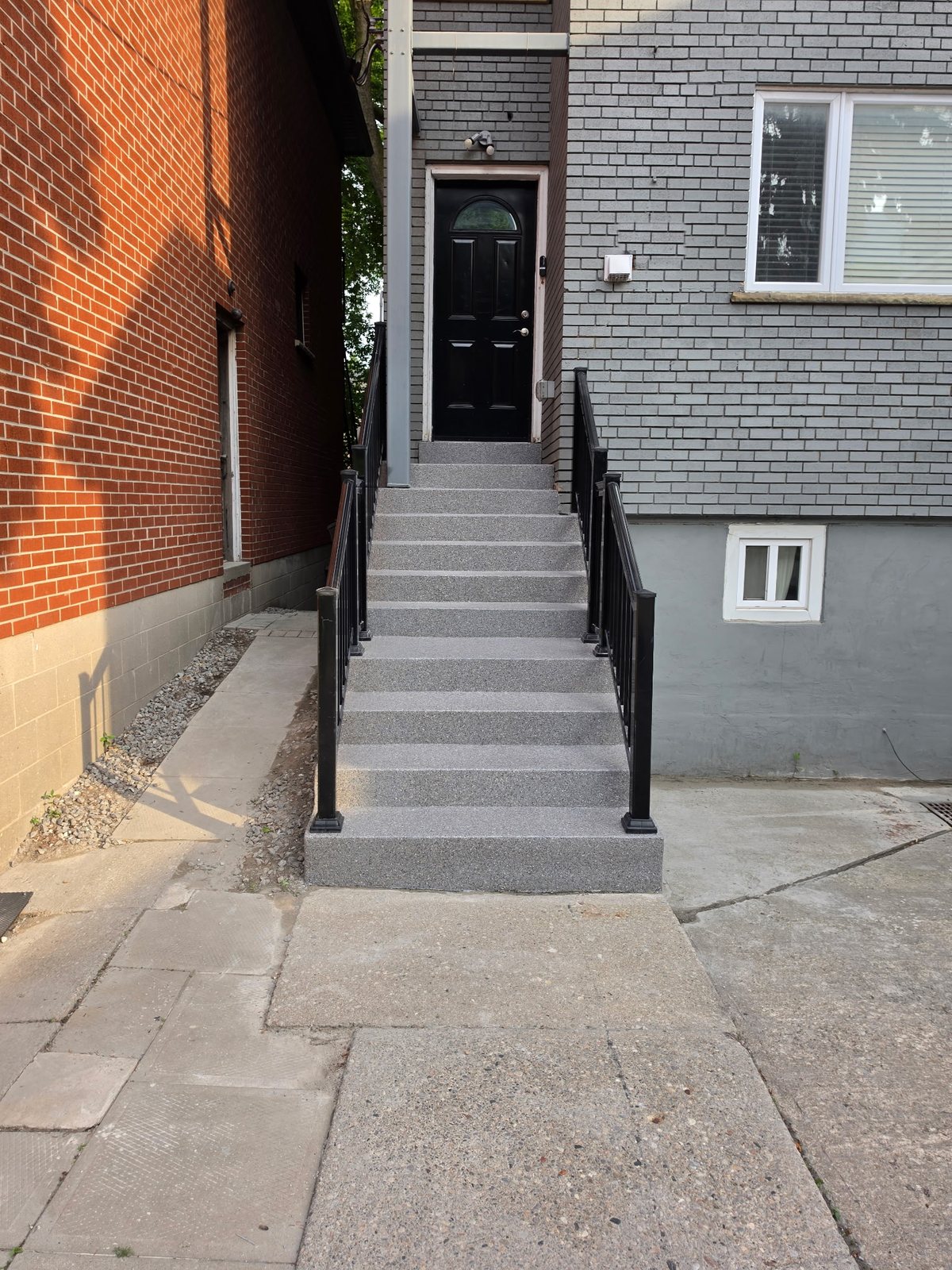 A Toronto front stair rebuilt and refinished, railings reinstalled